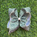 5" Green and cream moon stitch hair bow.