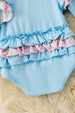 Lt blue boots applique baby bodysuit with floral ruffle on sleeves and ruffle butt. RPG61922 SOL