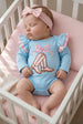 Lt blue boots applique baby bodysuit with floral ruffle on sleeves and ruffle butt. RPG61922 SOL