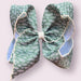5" Green and cream moon stitch hair bow.
